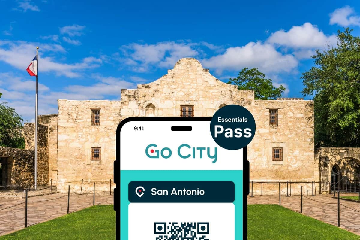 San Antonio Essentials Pass A mobile phone displaying a 'Go City San Antonio Essentials Pass' QR code overlaying an image of the Alamo under a blue sky.